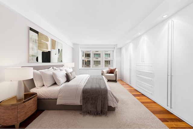 45 Sutton Pl S Unit 11K, New York City, NY 10022 - bedroom with light wood-type flooring and recessed lighting