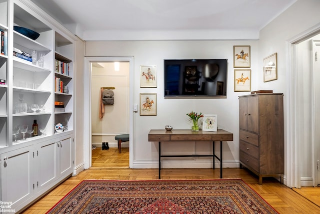 interior space featuring baseboards