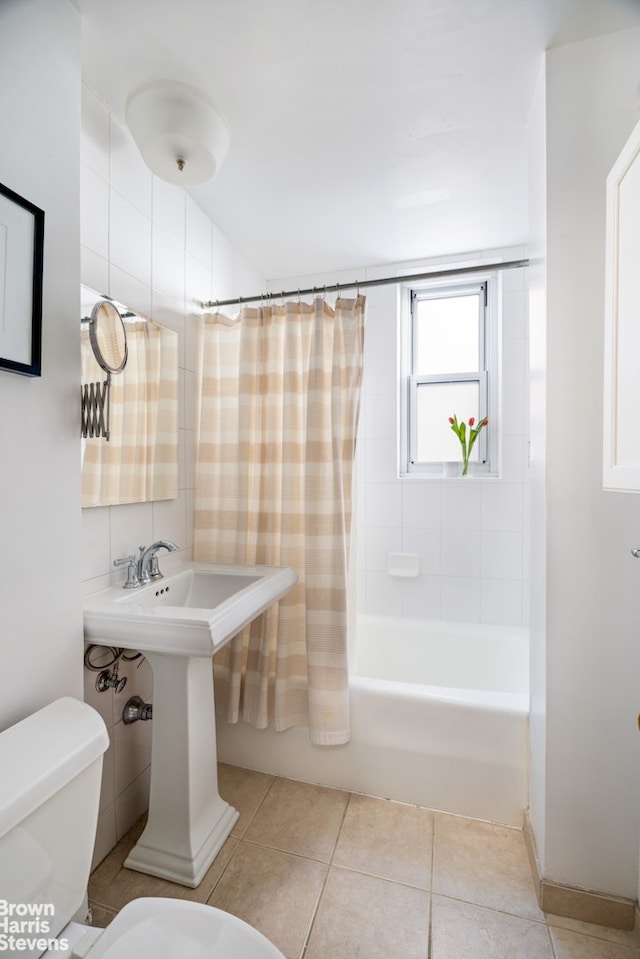 full bathroom with toilet, tile patterned floors, and shower / bath combo