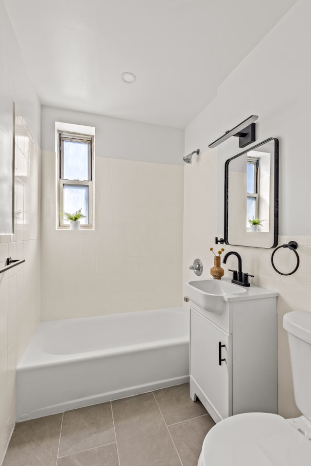 221 Mcdonald Ave Unit 6B, New York City, NY 11218 - full bathroom with toilet, tile patterned flooring, vanity, and shower / bathtub combination