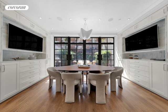226 W 71st St, New York City, NY 10023 - dining area featuring ornamental molding, light wood-style flooring, recessed lighting, and french doors
