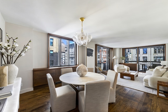 108 5th Ave Unit 8B, New York City, NY 10011 - dining room with a chandelier and dark wood finished floors