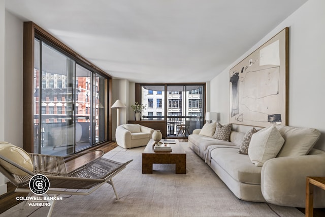 living room featuring a wall of windows and healthy amount of natural light