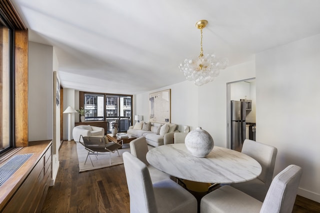 108 5th Ave Unit 8B, New York City, NY 10011 - dining area featuring a chandelier and dark wood-style floors