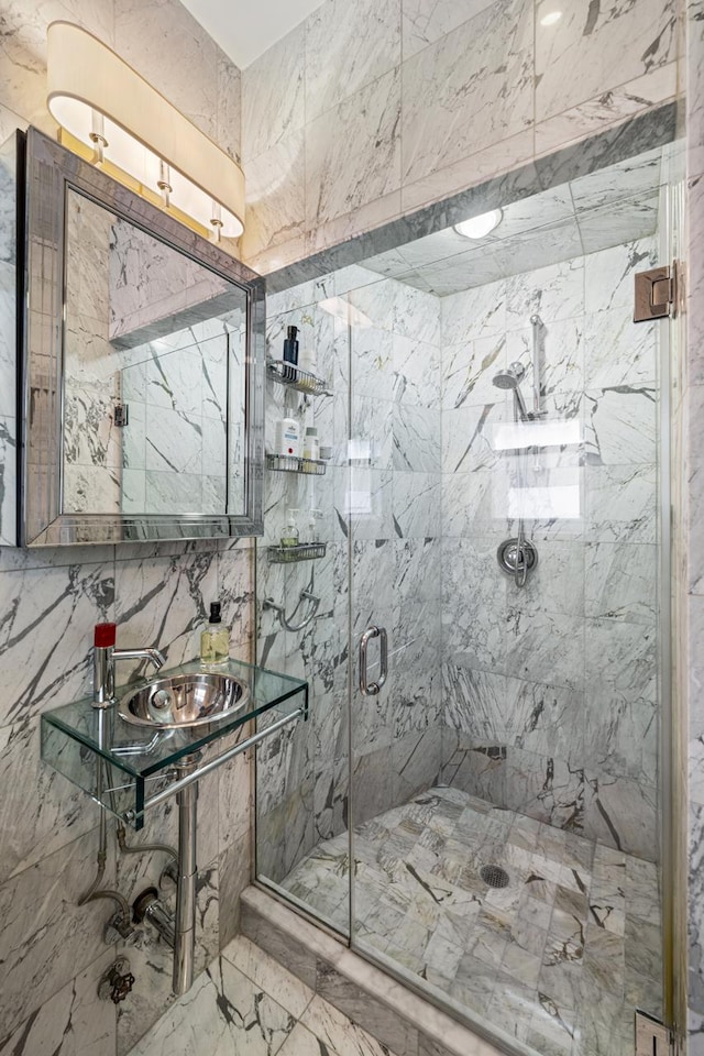 120 E 85th St Unit 2-E, New York City, NY 10028 - bathroom with a marble finish shower, marble finish flooring, and a sink