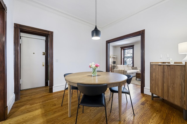120 E 85th St Unit 2-E, New York City, NY 10028 - dining area with ornamental molding, wood finished floors, and baseboards