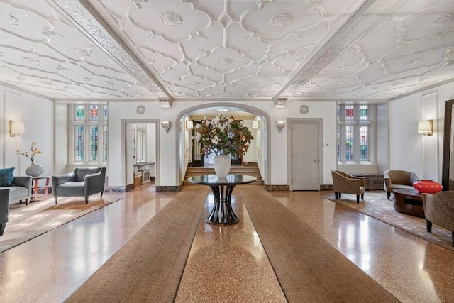 common area with an ornate ceiling and crown molding