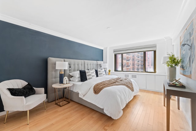 425 E 63rd St Unit E9D, New York City, NY 10065 - bedroom with ornamental molding and light wood-style floors