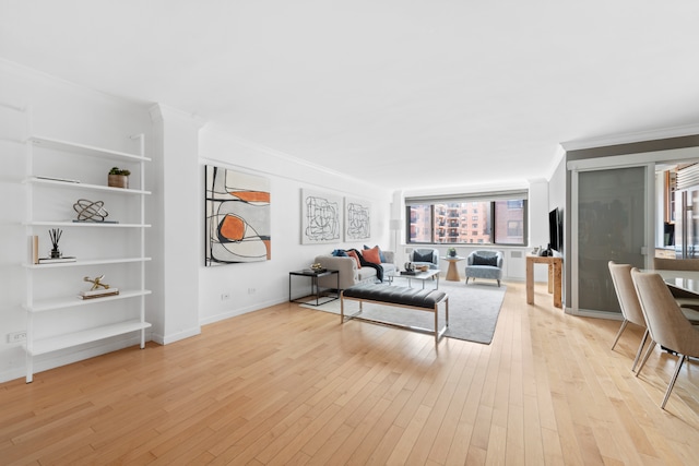 425 E 63rd St Unit E9D, New York City, NY 10065 - living area featuring ornamental molding, light wood-type flooring, and built in shelves