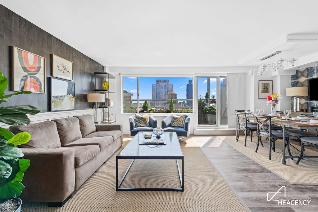 363 E 76th St Unit 18F, New York City, NY 10021 - living area featuring rail lighting and wooden walls