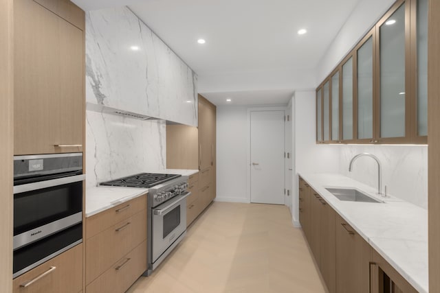 200 Amsterdam Ave Unit 7B, New York City, NY 10023 - kitchen featuring stainless steel appliances, a sink, modern cabinets, tasteful backsplash, and recessed lighting
