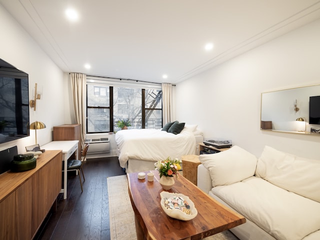 bedroom featuring dark wood finished floors and recessed lighting