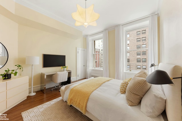390 W End Ave Unit 5H, New York City, NY 10024 - bedroom featuring wood finished floors, crown molding, and baseboards
