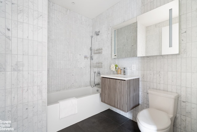 444 Pulaski St Unit 1, New York City, NY 11221 - bathroom featuring tile walls, vanity, shower / tub combination, and tile patterned floors