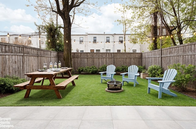 444 Pulaski St Unit 1, New York City, NY 11221 - fenced backyard featuring an outdoor fire pit, outdoor dining area, and a patio