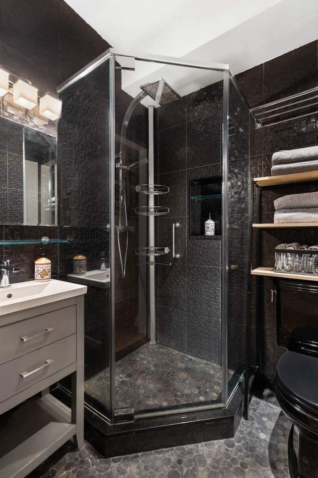 229 W 97th St Unit 1E, New York City, NY 10025 - full bathroom with vanity, a stall shower, and toilet