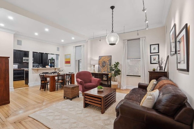 229 W 97th St Unit 1E, New York City, NY 10025 - living area featuring crown molding, recessed lighting, baseboards, and rail lighting