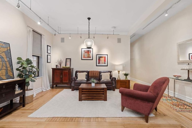 229 W 97th St Unit 1E, New York City, NY 10025 - living room featuring track lighting, baseboards, and wood-type flooring