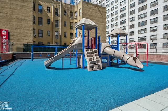 communal playground featuring fence
