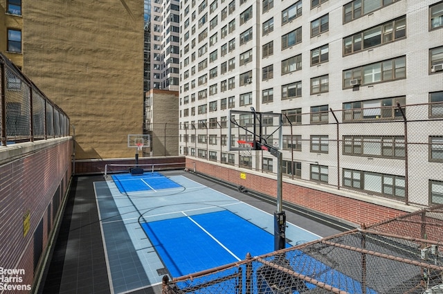 view of sport court with community basketball court and fence