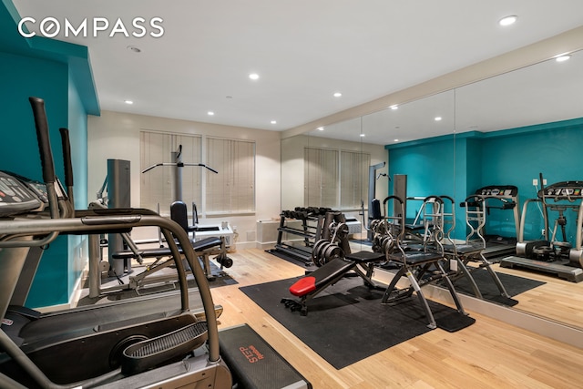 gym with wood finished floors and recessed lighting