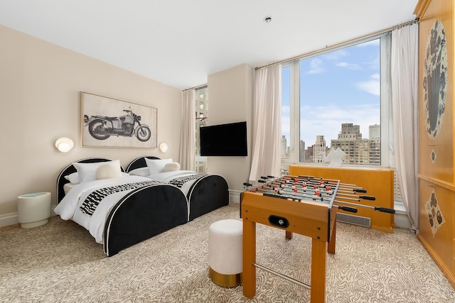300 E 77th St Unit 30B, New York City, NY 10075 - carpeted bedroom with baseboards