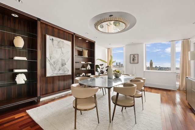 300 E 77th St Unit 30B, New York City, NY 10075 - dining room with wood-type flooring and baseboards