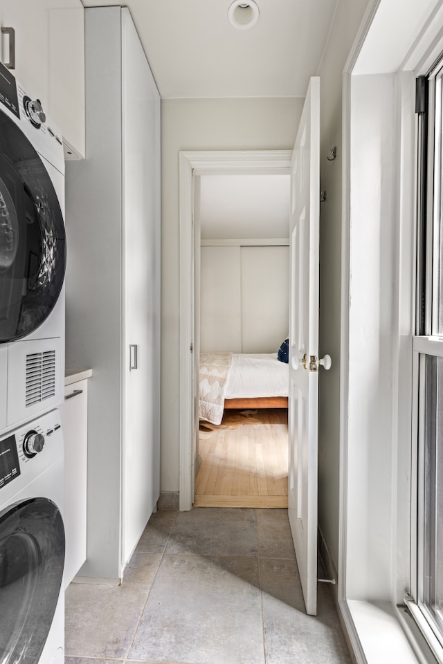 washroom featuring estacked washer and dryer