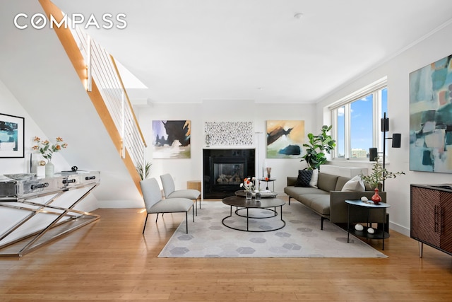 301 W 115th St Unit Ph4C, New York City, NY 10026 - living room featuring baseboards, wood finished floors, and a tiled fireplace