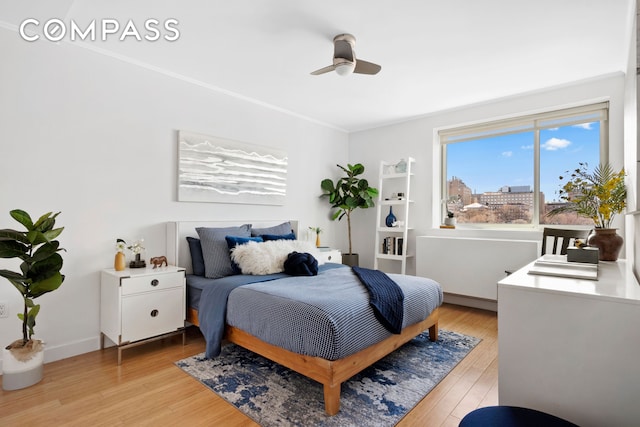 301 W 115th St Unit Ph4C, New York City, NY 10026 - bedroom with light wood-type flooring, crown molding, and ceiling fan