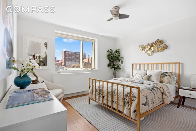 301 W 115th St Unit Ph4C, New York City, NY 10026 - bedroom featuring wood finished floors, baseboards, and ceiling fan