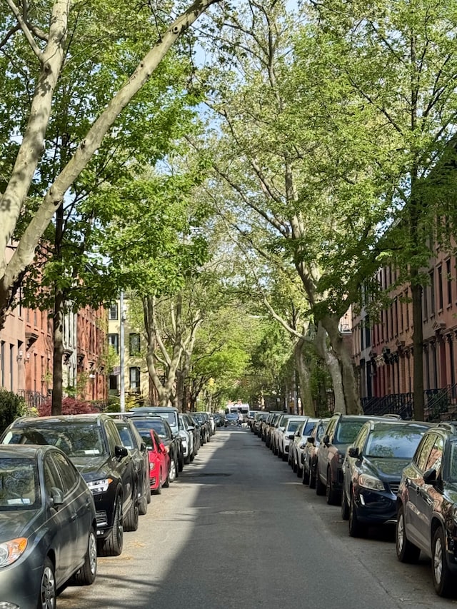 view of parking featuring fence