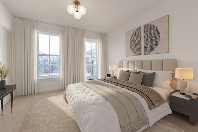 bedroom with carpet flooring, a notable chandelier, and multiple windows