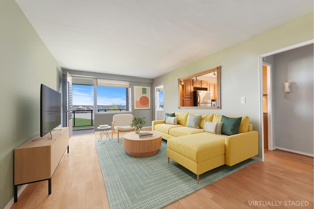 5800 Arlington Ave Unit 1H, New York City, NY 10471 - living area featuring light wood-style flooring and baseboards