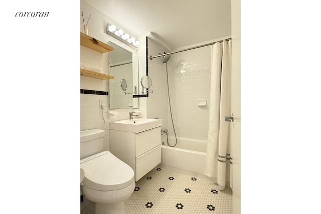 420 Classon Ave Unit C, New York City, NY 11238 - bathroom featuring tile walls, shower / tub combo, vanity, tile patterned floors, and toilet