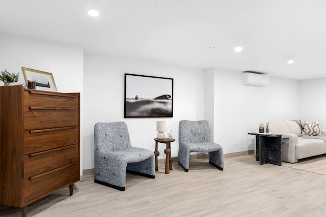256 Putnam Ave Unit 1, New York City, NY 11216 - living area featuring an AC wall unit, light wood-style flooring, and recessed lighting