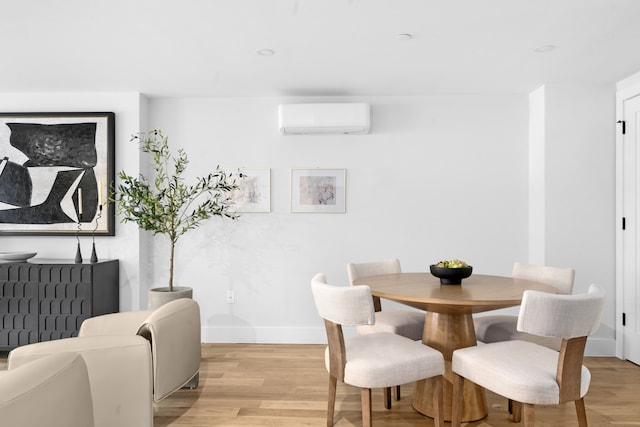 256 Putnam Ave Unit 1, New York City, NY 11216 - dining room with a wall unit AC and light wood finished floors