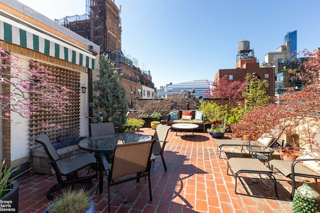 view of patio featuring outdoor dining area