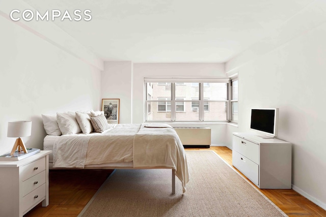 bedroom featuring baseboards