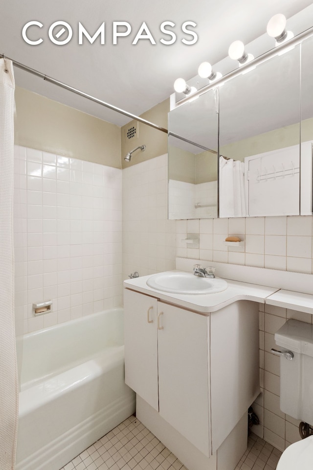 bathroom with vanity, shower / tub combo, tile patterned floors, and toilet