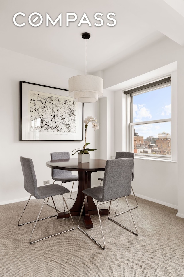 11 5th Ave Unit 18A, New York City, NY 10003 - dining room featuring carpet flooring and baseboards