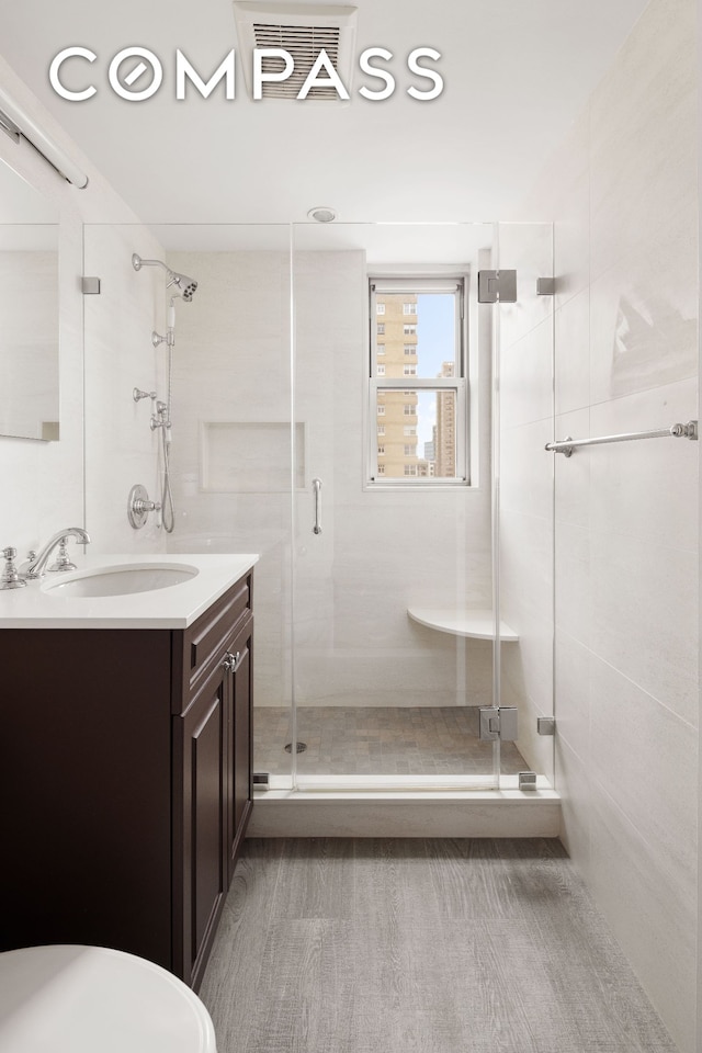 11 5th Ave Unit 18A, New York City, NY 10003 - full bath featuring a stall shower, vanity, and toilet