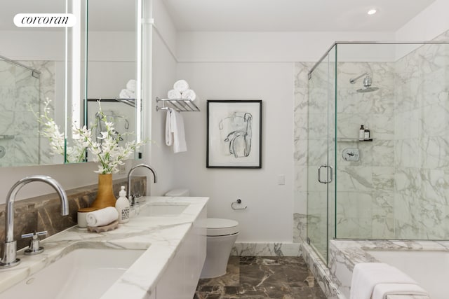 25 Columbus Cir Unit 56F, New York City, NY 10019 - bathroom featuring marble finish flooring, a marble finish shower, double vanity, and recessed lighting