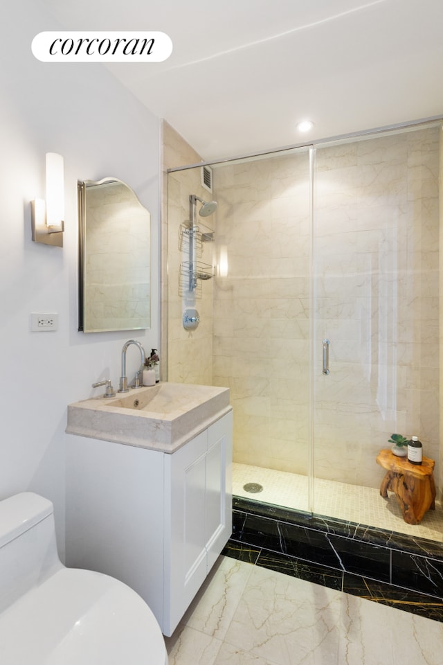 25 Columbus Cir Unit 56F, New York City, NY 10019 - bathroom featuring marble look tile flooring, a shower stall, vanity, and recessed lighting