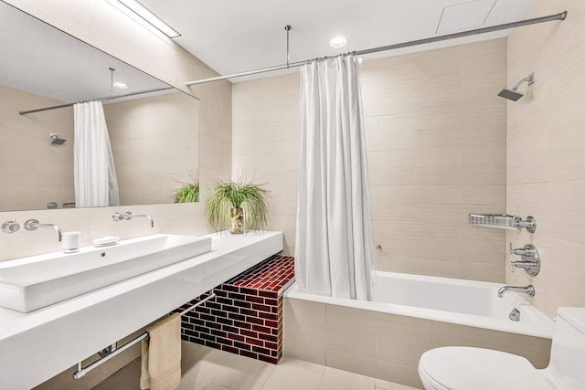 92 Greene St Unit 4, New York City, NY 10012 - bathroom featuring a sink, tiled shower / bath combo, and toilet