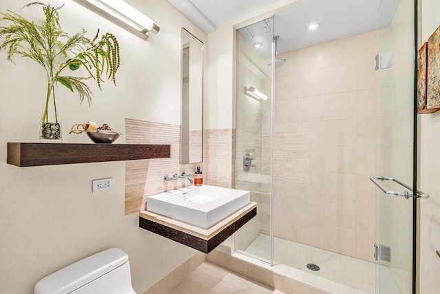 92 Greene St Unit 4, New York City, NY 10012 - bathroom with a sink, a shower stall, and toilet