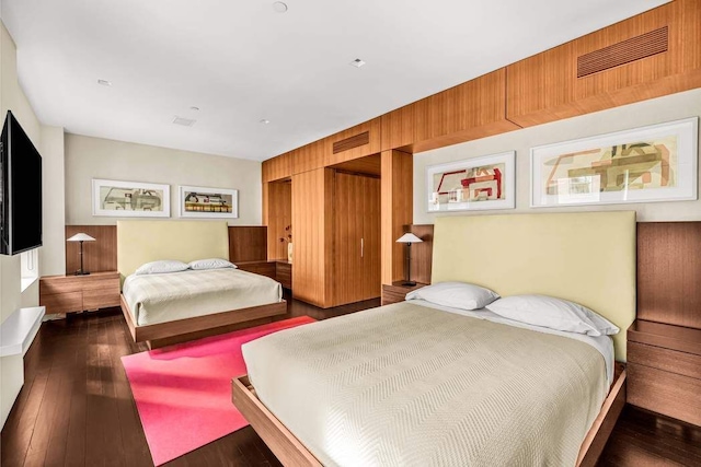 92 Greene St Unit 4, New York City, NY 10012 - bedroom featuring dark wood-style flooring and visible vents