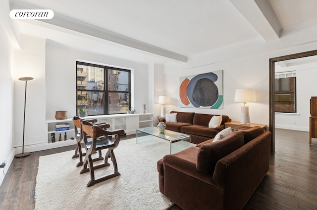 12 W 72nd St Unit 12D, New York City, NY 10023 - living area featuring beamed ceiling, dark wood-style flooring, and baseboards