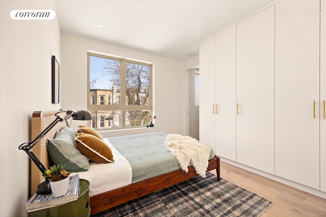 bedroom with light wood-type flooring