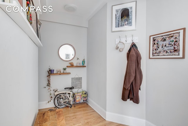 interior space featuring wood finished floors and baseboards